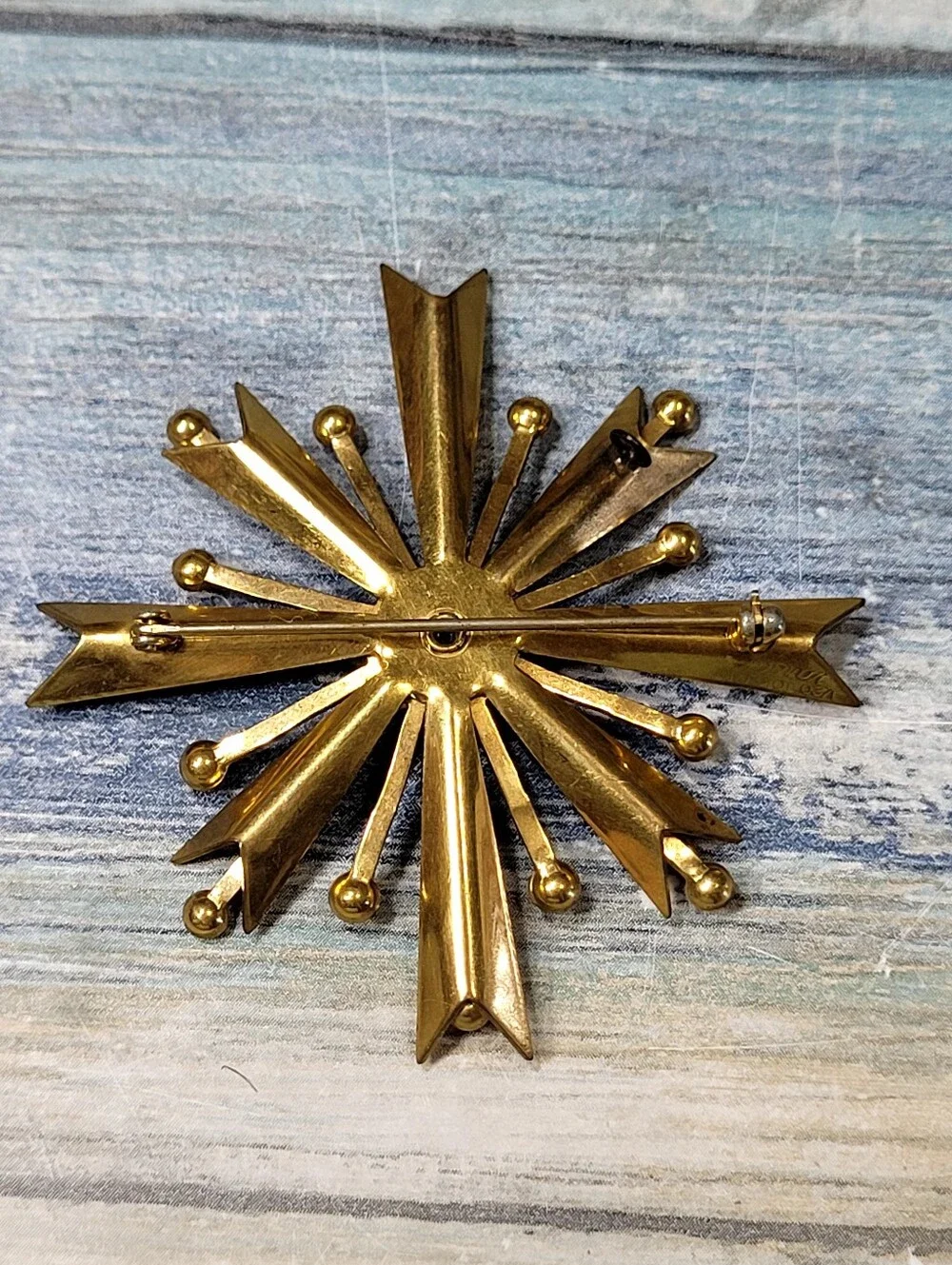 Gold Starburst Brooch and Earring Set with Red Rhinestones